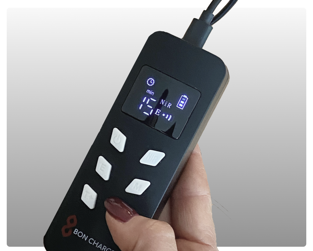 Someone Controlling Red Light Face Mask Controller